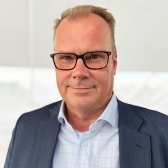 Portrait of Mikael Lidström in dark grey suit